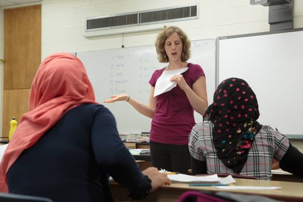 Teacher Vanessa Zacharias addresses her English class at W.C. Miller Collegiate on the last day of school. Her students have made significant progress in spoken and written English since beginning their studies.