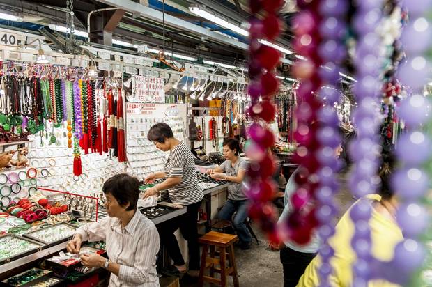 Workers go about their day at the old outdoor Jade Market in Kowloon, Hong Kong, in 2012.