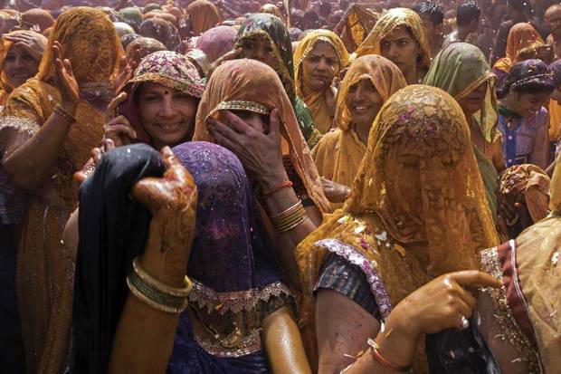 Hindi women participate in the Holi festival. 