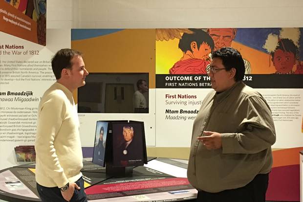 Charlie Sault speaks with Josh Hellyer at the Mississaugas of the New Credit Interpretive Centre. Mr. Sault works as a community liaison between Indigenous communities and businesses to match youth with potential employers.