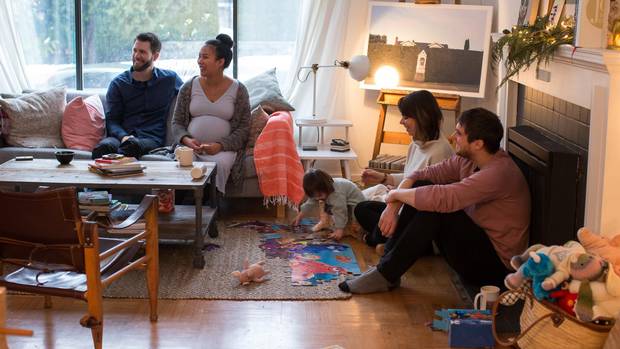 Conor and Veronica Lorimer talk with roommates Matt and Danielle Clarke and their daughter Frances, 2, at their home in Vancouver, British Columbia on December 28, 2016.