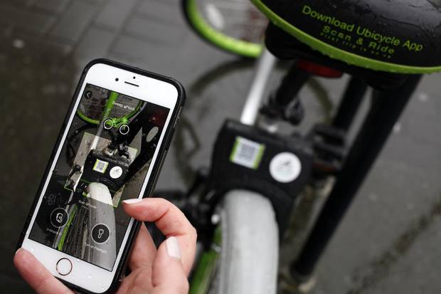 Riders find the nearest bike by using a map on an app, and unlock it with their phones. Riders typically pay $1 a half-hour or a ride.