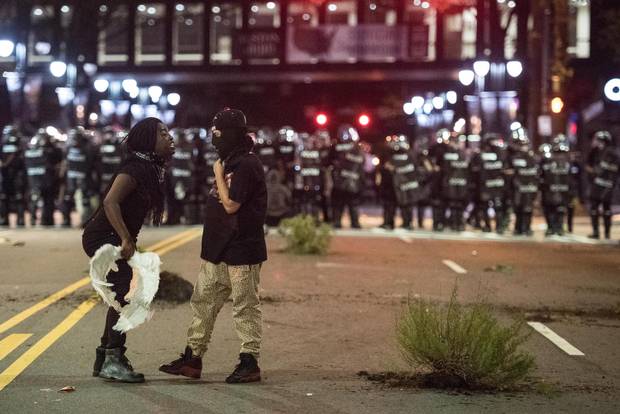 Demonstrators argue during Wednesday’s protests in Charlotte. The North Carolina governor has declared a state of emergency in the city.