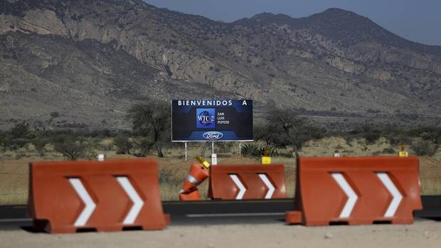 A welcome sign stands at the site where Ford's suppliers and service providers were to have been housed, one day after Ford cancelled plans to build the plant in Villa de Reyes, outside San Luis Potosi, Mexico, Wednesday, Jan. 4, 2017.
