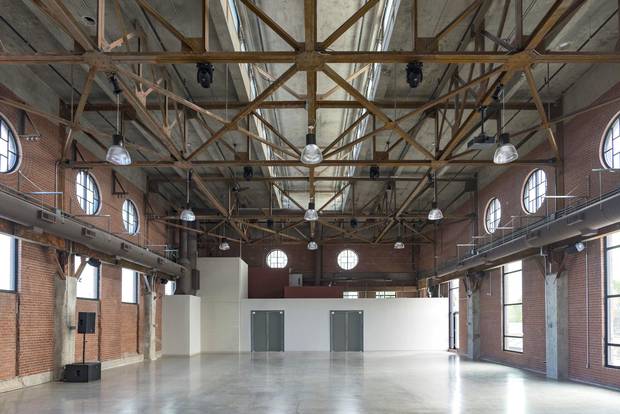 The Symes spent 'a gazillion dollars' restoring the space, highlighting original features such as the concrete columns and steel beams along the ceiling.