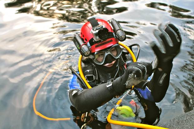 Researcher Valérie Brosseau of the University of Toronto makes final preparations before a dive at the archeological site.