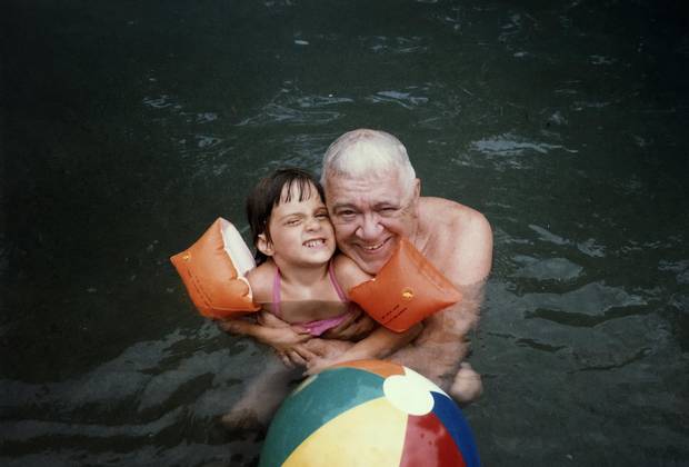 Susan Krashinsky Robertson with her grandfather Paul Urion in the pool in Rochester, New Hampshire, summer 1985.