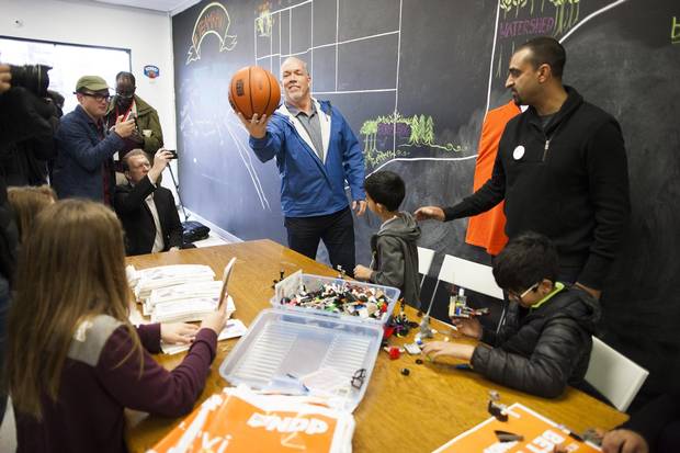 BC NDP Leader John Horgan, centre, plays with a basketball during a visit to BC NDP candidate Ravi Kahlon’s, right, campaign office in Delta, B.C., on Monday.