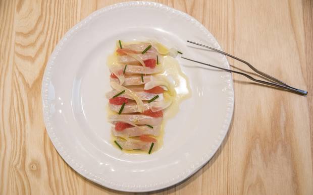The dorada 'case-crudo' dish, marinated with coffee, grapefruit, and citrus, is displayed at Campo.