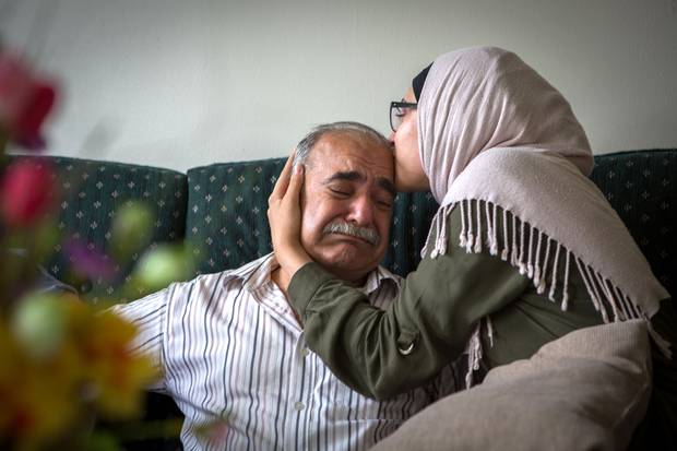 Mohamed Sharbaji gets a hug from his daughter Sedra, after he tells her his dream for her is that she can ‘look up at the sky and feel happy.’ Once an elected official in a neighbourhood in Aleppo, Syria, Mr. Sharbaji now lives in Saint John. His daughter, who picked up English quickly, is now his main lifeline to the outside world.