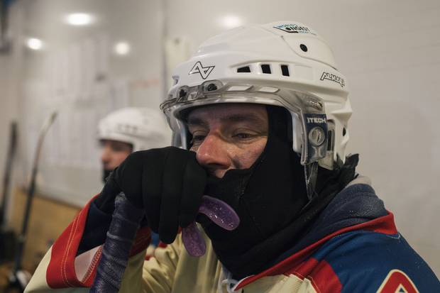 Scott Littlefair, wearing a face mask to protect him from the cold, takes a break toward the end of his shift.