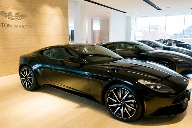 The mandate of fulfilling a consistent brand experience is plainly visible at the Grand Touring dealership, where a variety of luxury brands adhere to strict, brand-specific aesthetic requirements, even within the same showroom. 