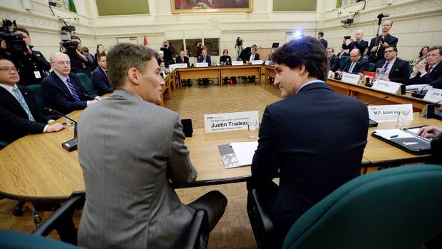 Prime Minister Justin Trudeau talks with Vancouver Mayor Gregor Robertson as he meets with the big city mayors in Ottawa on Friday, Feb. 5, 2016.