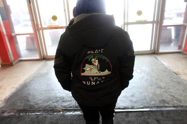 A member of the Nunavik Nordiks walks outside March 24, 2017 in Ottawa. The Inuit girl's hockey team is in Ottawa for a tournament. 
