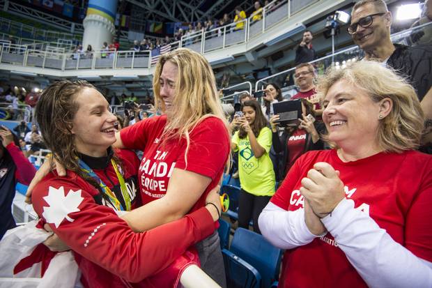 Penny Oleksiak with family members after she won gold in Women's 100m Freestyle Final at Olympic Aquatics Stadium during Rio Olympics August 11, 2016.