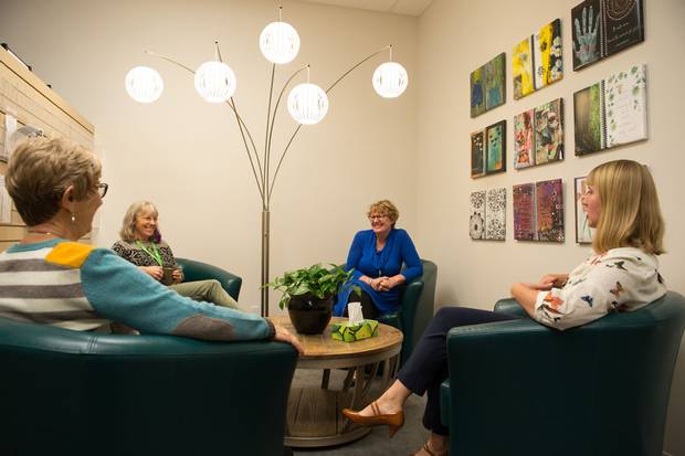 Members sit in the conversation area at Wellspring Calgary’s Fountain Court location. The organization provides free non-medical support to people living with any stage of cancer, from diagnosis to post-treatment.