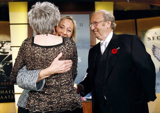 Elizabeth Hay, centre, is congratulated by Alice Munro and Jack Rabinovitch, right, after accepting the 2007 Giller Prize.