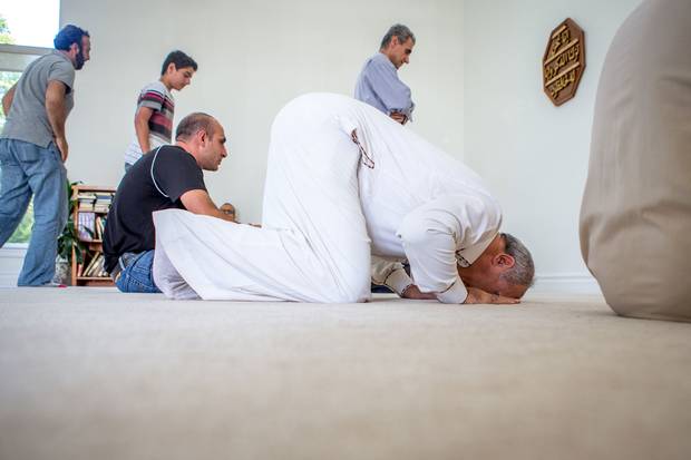 Mr. Sharbaji prays at the mosque during Friday prayers.