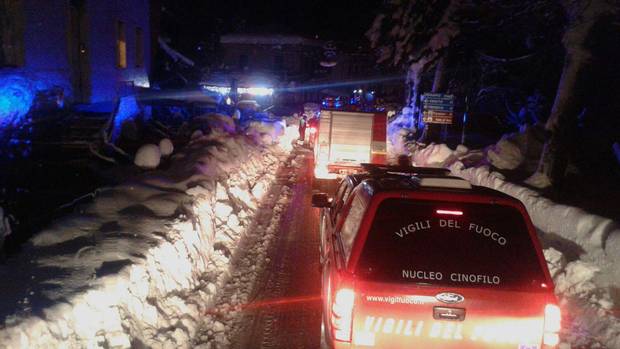 Rescue efforts were hampered by the large snowfall in recent days. Here, firefighters are shown making their way to the hotel early Thursday.