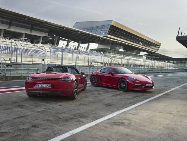 The 2018 Porsche Boxster GTS, left, and 718 Cayman.