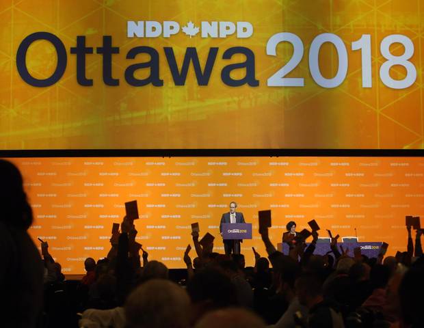 NDP delegates show hands as they vote on resolutions in Ottawa on Feb. 16, 2018.