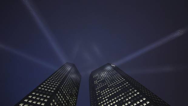 The headquarters of Deutsche Bank is spotlighted during a opening ceremony in Frankfurt in this February 24, 2011 file photo. 