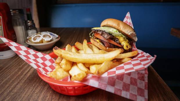 Banquet Burgers, stacked with cheese, bacon, lettuce and tomato are one of the favourite dishes at Harry's.