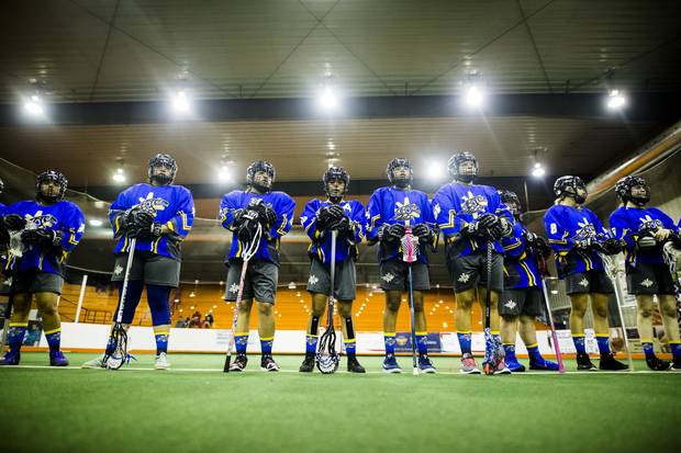 Team BC lines up before playing Team Ontario during their under 19 women's lacrosse match at the Iroquois Lacrosse Arena during 2017 North American Indigenous Games in Toronto, Monday July 17, 2017.