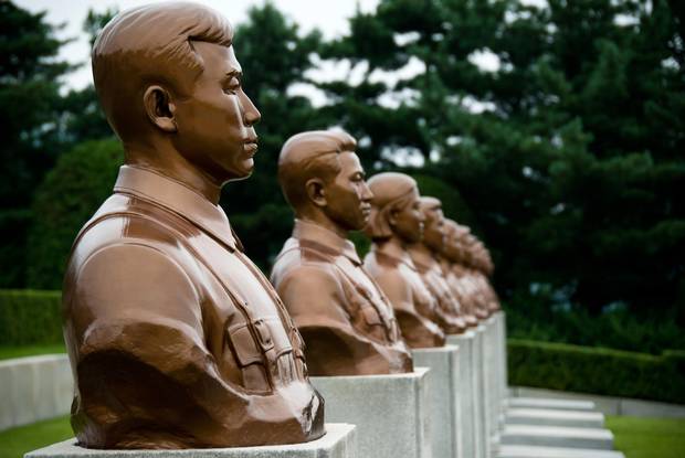 Many hours were spent being shuttled around Pyongyang and Kaesong – from one enormous grey or bronze monument to another. North Korea. Revolutionary Martyrs' Cementary.