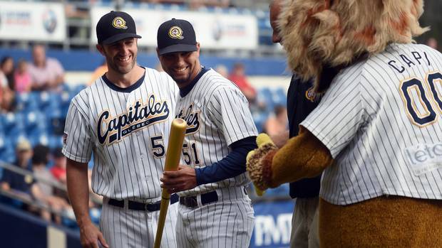 Yuniesky Gurriel (CENTRE) was awarded a golden bat for winning the Can-Am League's batting title with a .374 average. Patrick Scalabrini, Director of Operations is LEFT. Four Cuban baseball players were legally allowed to leave the country to play baseball in Canada for the Quebec Capitales. This is a new venture for Cuba which is now only beginning to see a thaw in it's relationship with the United States.