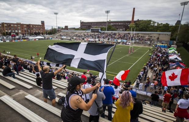 Fans wave flags as the Toronto Wolfpack play the Whitehaven RLFC at Lamport Stadium in Toronto on Saturday Sept. 2, 2017.