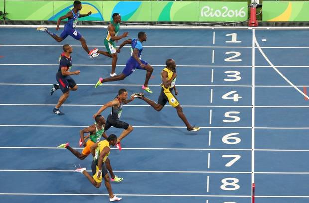 2016 Rio Olympics - Athletics - Final - Men's 100m Final - Olympic Stadium - Rio de Janeiro, Brazil - 14/08/2016. Usain Bolt (JAM) of Jamaica wins the gold medal in the men's 100m final. REUTERS/Carlos Barria
