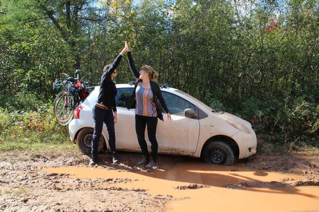 The duo's Toyota stuck in PEI mud.