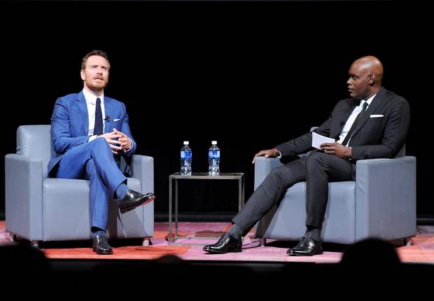 Actor Michael Fassbender and TIFF Artistic Director Cameron Bailey speak onstage at the TIFF Soiree during the 2016 Toronto International Film Festival at TIFF Bell Lightbox on September 7, 2016 in Toronto, Canada.