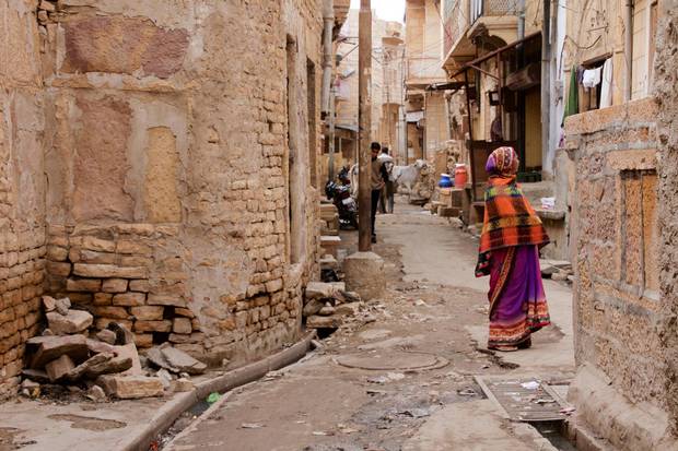 An alleyway in Jaisalmer. The ancient city remains in good repair, despite the odd rubble pile of sandstone bricks.