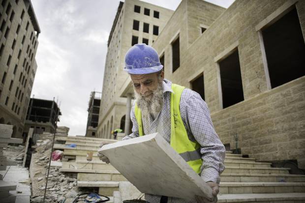 A Palestinian construction worker in Rawabi.