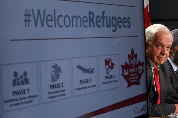 John McCallum, Minister of Immigration, Refugees and Citizenship, announces Canada's plan to resettle 25,000 Syrian refugees at a press conference at the National Press Theatre in Ottawa on Nov. 24, 2015.