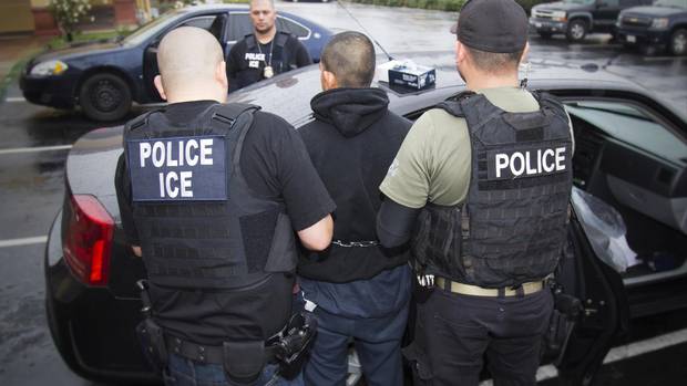 In this photo taken Feb. 7, 2017, an arrest is made during a targeted enforcement operation conducted by U.S. Immigration and Customs Enforcement (ICE).