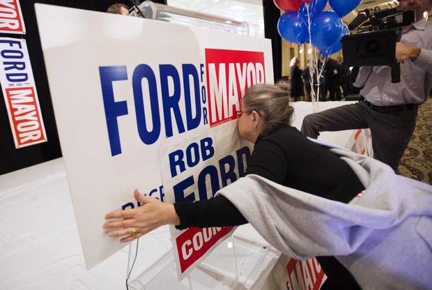 Gail Chernesky kisses a sign at Doug Ford's election night headquarters in 2014.