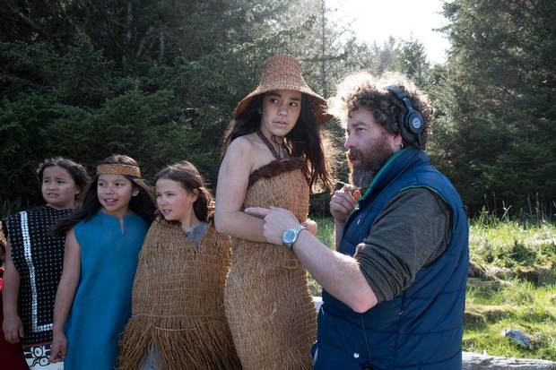 Director Gwaai Edenshaw (righy) on set in the ancient village of Yan, Haida Gwaii.