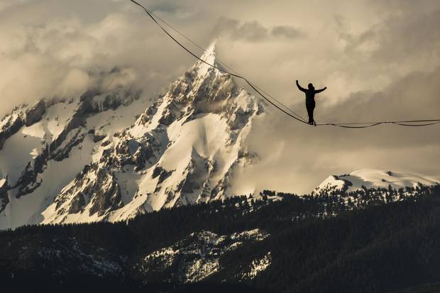 A silhouette of Mia Noblet on a slackline close to the Stawamus Chief in Squamish, B.C. There is a burgeoning subculture around extreme versions of slacklining, a type of tightrope walking.