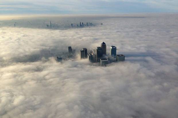 The buildings of London’s Canary Wharf financial district rise above the morning fog. Resentment of the liberal establishment embodied by London – which, unlike the rest of England, largely voted Remain – helped to widen the cultural divide that made Brexit possible.