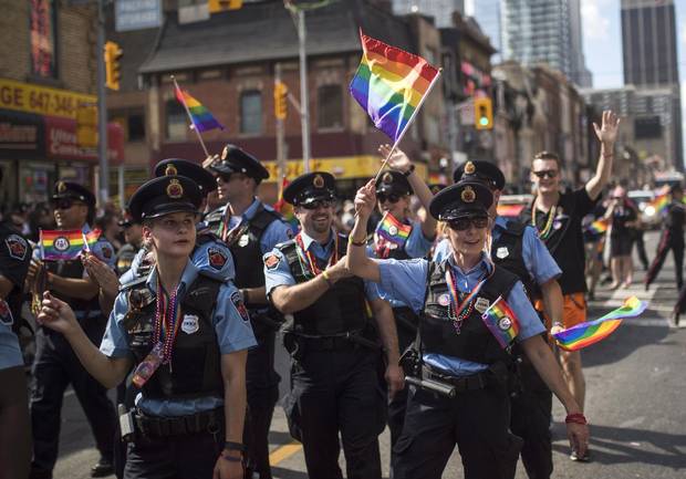 Hamilton, Ont., police officers march along the parade route during the annual Pride Parade in Toronto, Sunday, July 3, 2016.