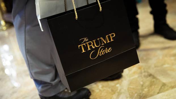 A visitor carries a 'Trump Store' bag at Trump Tower, November 22, 2016 in New York City.