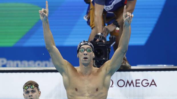 USA's Michael Phelps celebrates after he won the Men's 200m Butterfly Final during the swimming event at the Rio 2016 Olympic Games at the Olympic Aquatics Stadium in Rio de Janeiro on August 9, 2016.