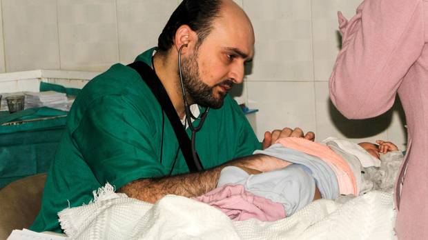 A picture taken on February 20, 2016 and released on April 29, 2016 by the Independant Doctors Association (IDA), a Syrian humanitarian NGO, shows Syrian doctor Muhammad Waseem Maaz working at Aleppo's pediatric hospital. Muhammad Waseem Maaz was killed on April 27, 2016 along with four colleagues and 22 civilians when air strikes hit al-Quds hospital.