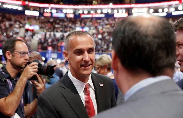 Corey Lewandowski talks to delegates as he arrives to the floor of Quicken Loans Arena during first day of the Republican National Convention in Cleveland.