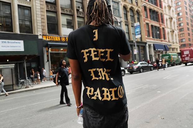 A fan wears a shirt from a Kanye West pop-up shop in Manhattan in August.