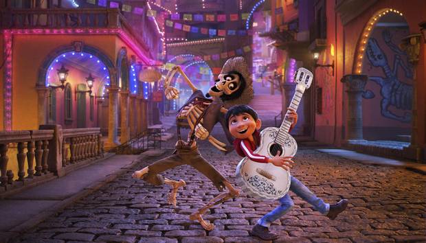 Miguel, voiced by Anthony Gonzalez, right, looks to Hector, voiced by Gael Garcia Bernal, to find the secret behind his family’s ban on music in Coco.