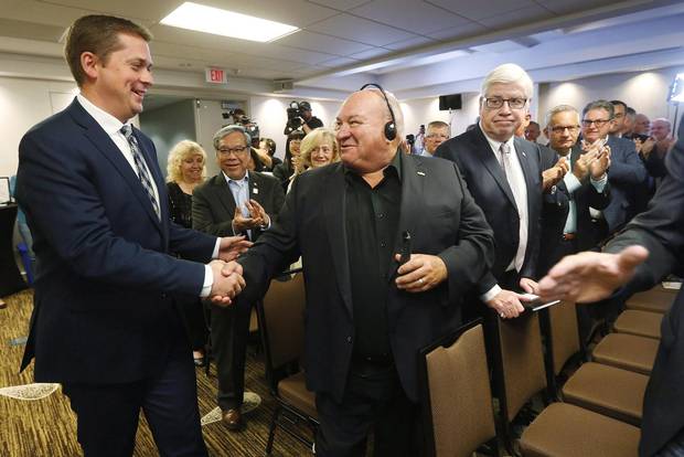 Conservative Party Leader Andrew Scheer greets supporters at his shadow cabinet meeting in Winnipeg, Thursday, September 7, 2017. Scheer opened a two-day meeting of Conservative MPs and senators by hammering on the Liberal government's plan to end what it calls unfair tax advantages for the wealthy by changing elements of the tax code. THE CANADIAN PRESS/John Woods
